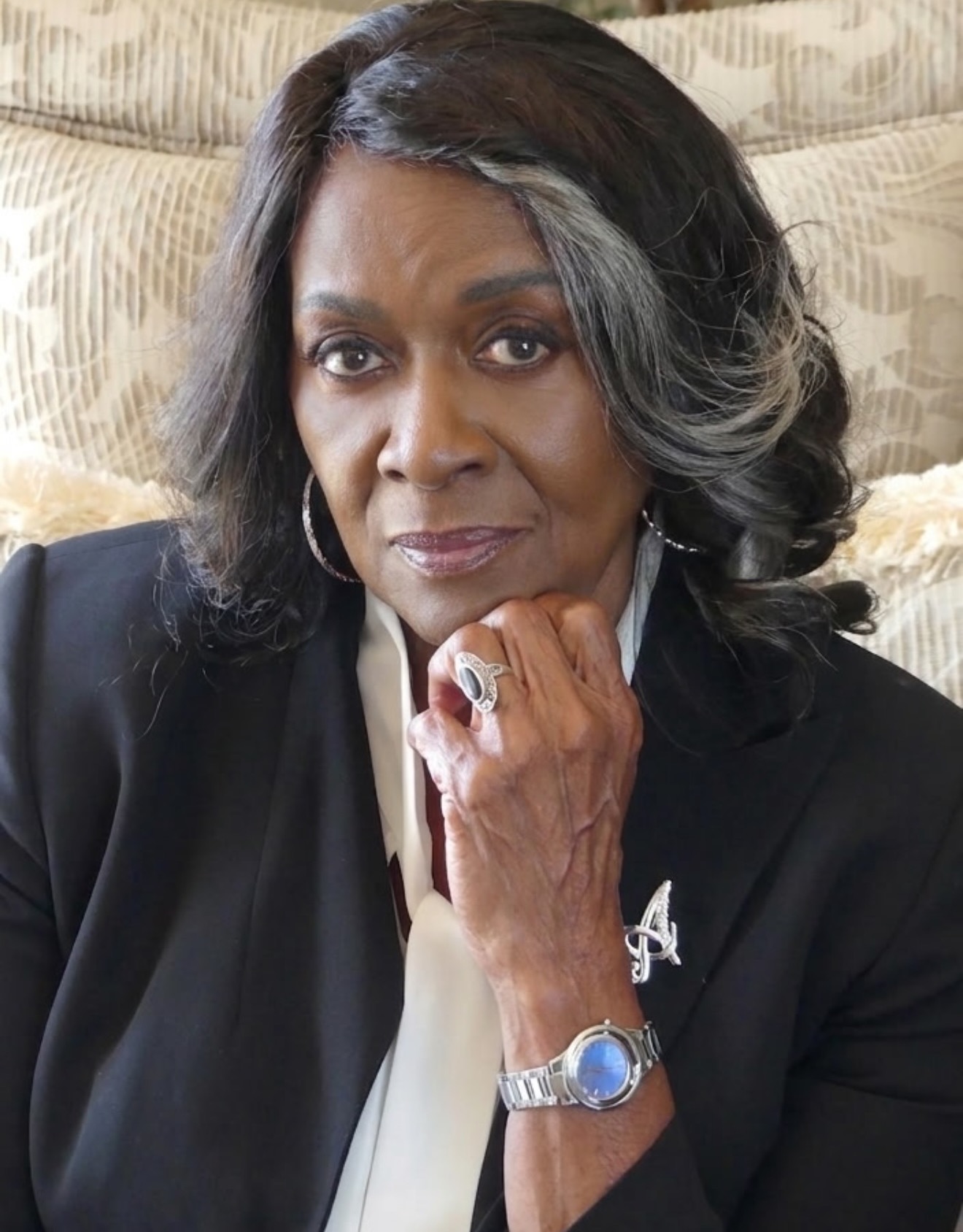 Aloma Wright in a silver jacket